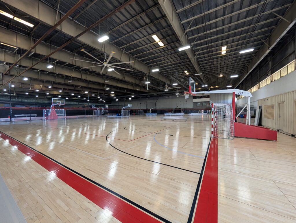 Wood court with hoop and futsal goal